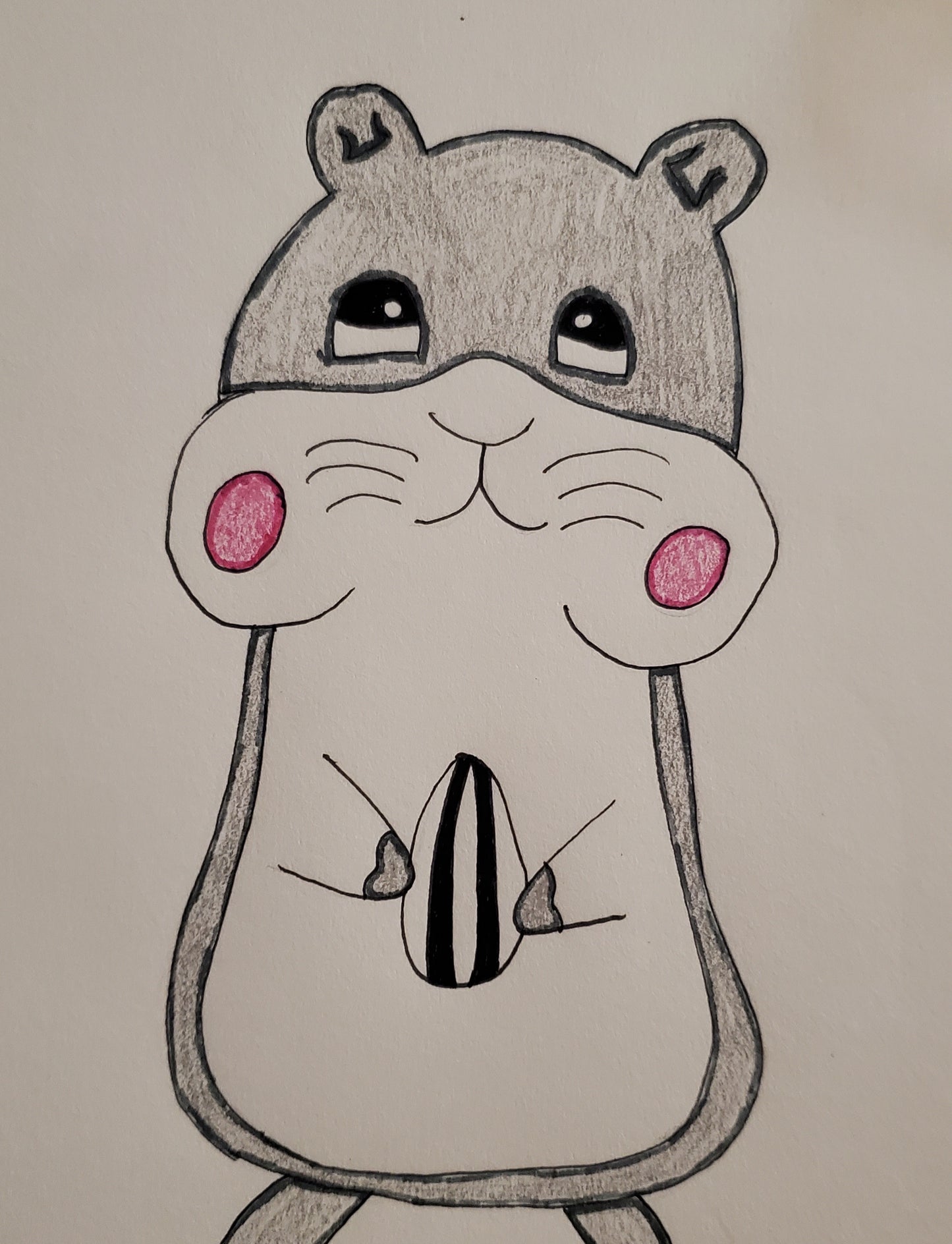 Hamster stuffing its cheeks