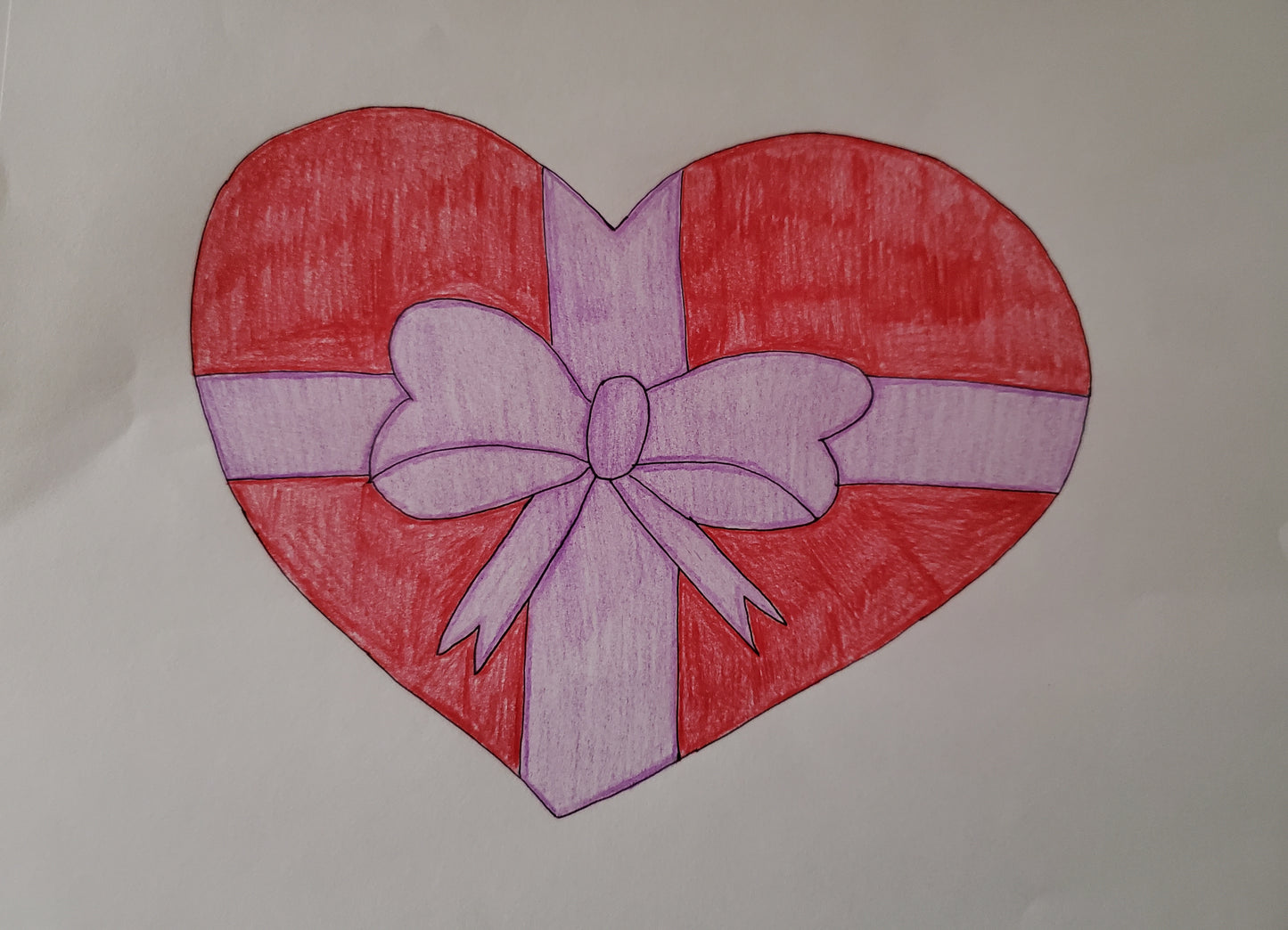 Heart wrapped with a ribbon