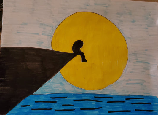 Person sitting on the edge of a cliff