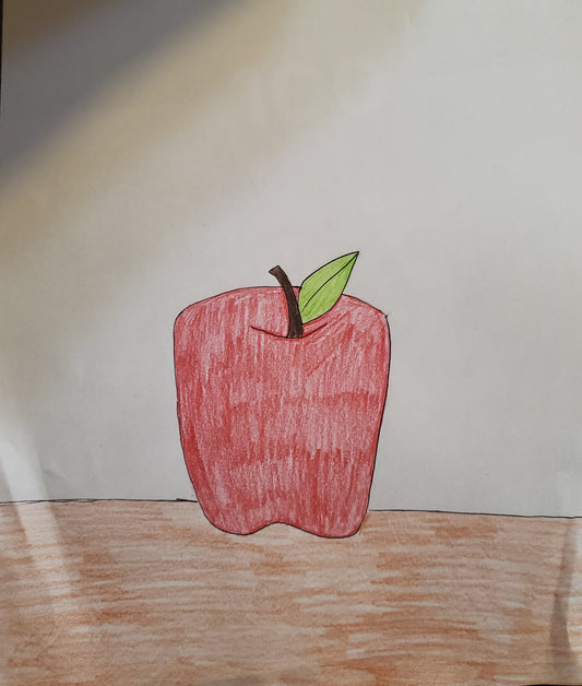 An apple sitting on a table