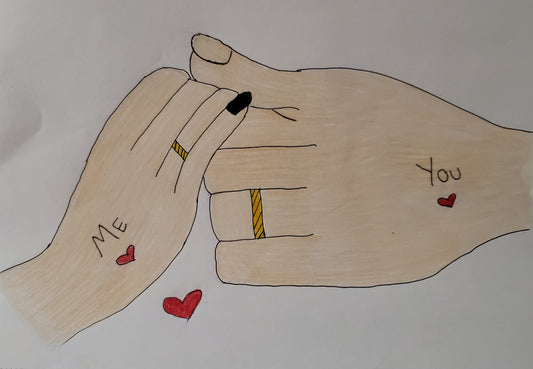 A male hand holding a female hand